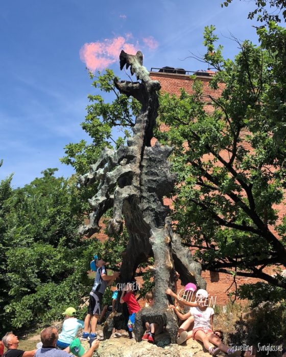 Krakow Dragon statue Smok Wawelski spits fire